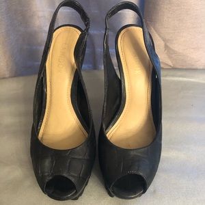Black leather sling back heels.